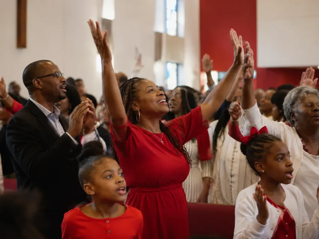 Congregation standing together in worship during a service