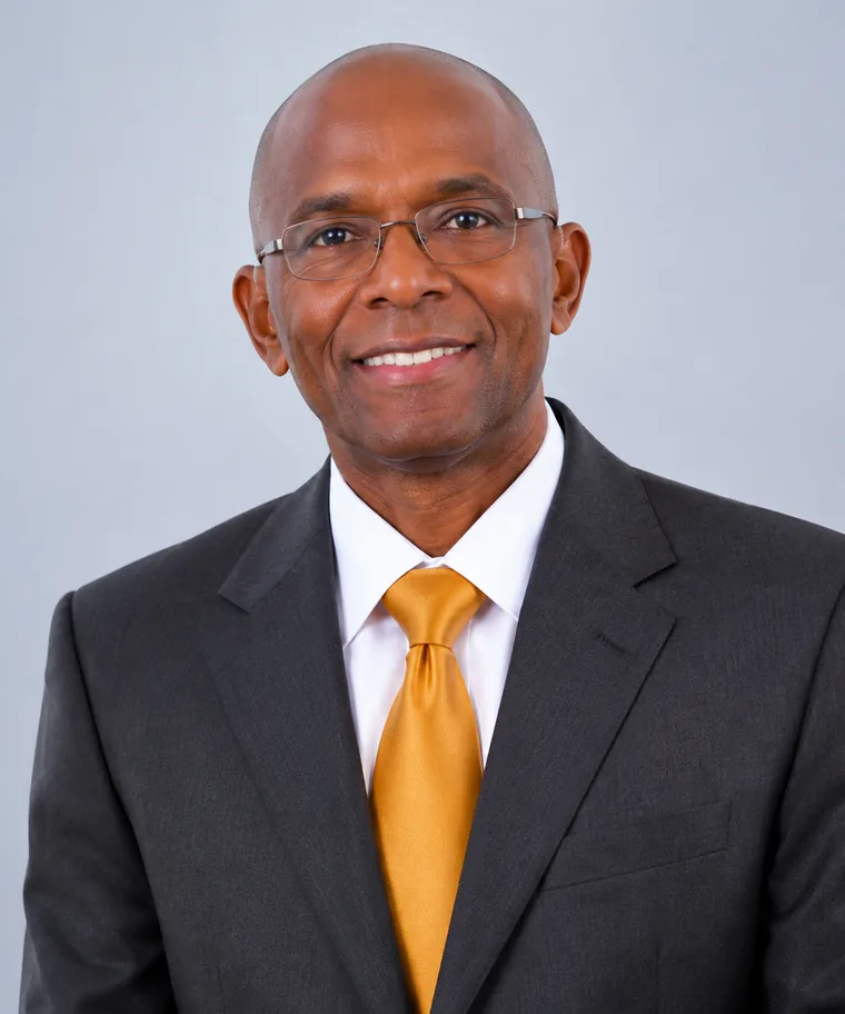 Portrait of a church leader in a dark suit and tie